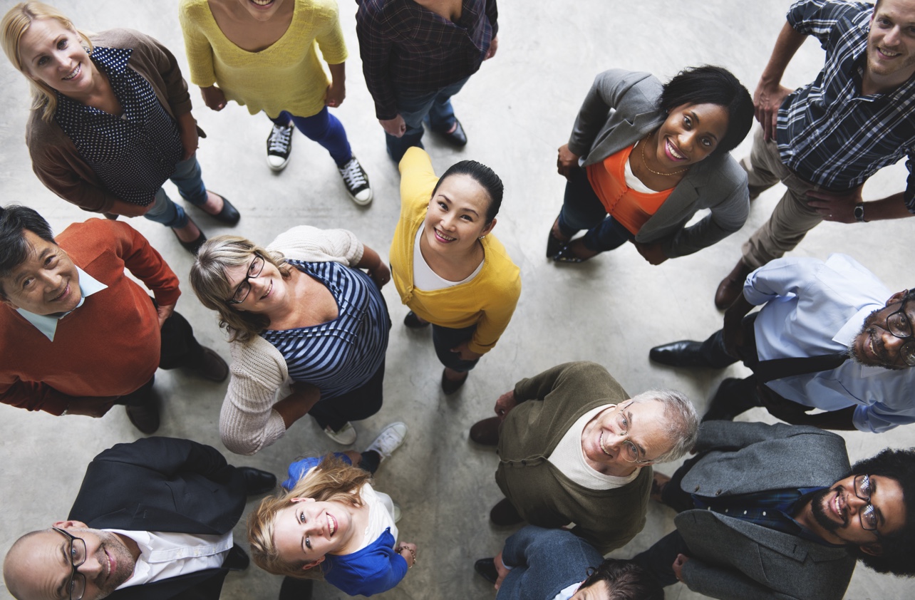 group of people looking up and smiling